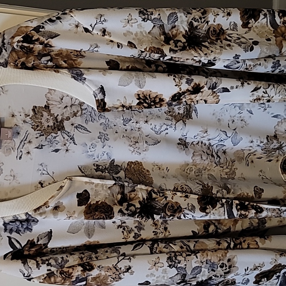Nylon/spandex jacket cream colored with dark brown and gray and cream on the jac